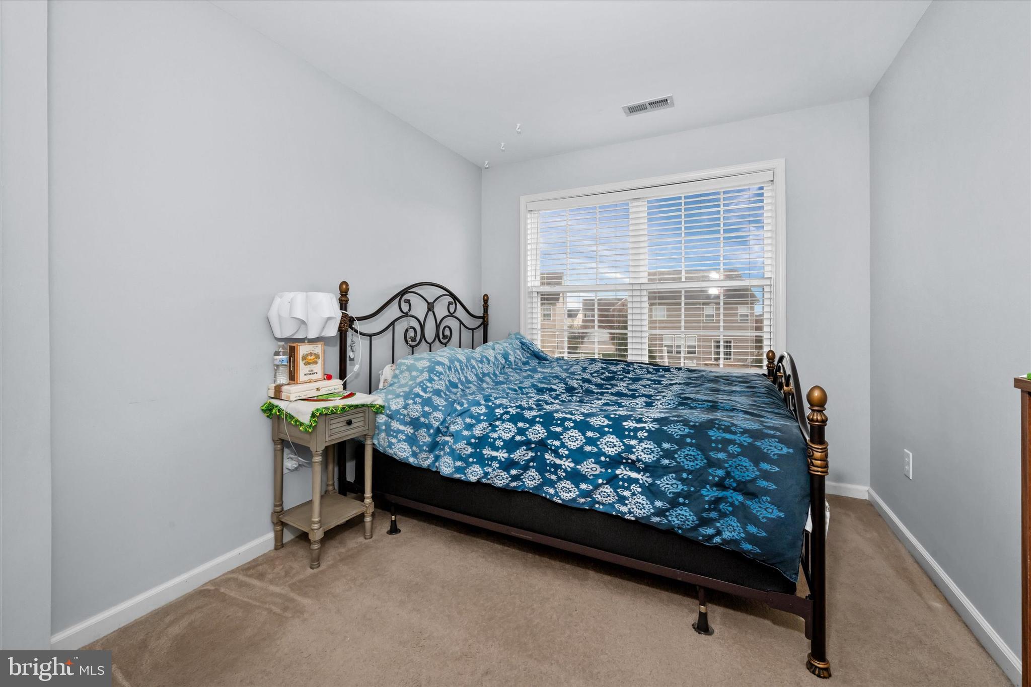 128 Springfield Circle Middletown, DE 19709 - Photo 15 of 22 a bed sitting in a bedroom next to a window