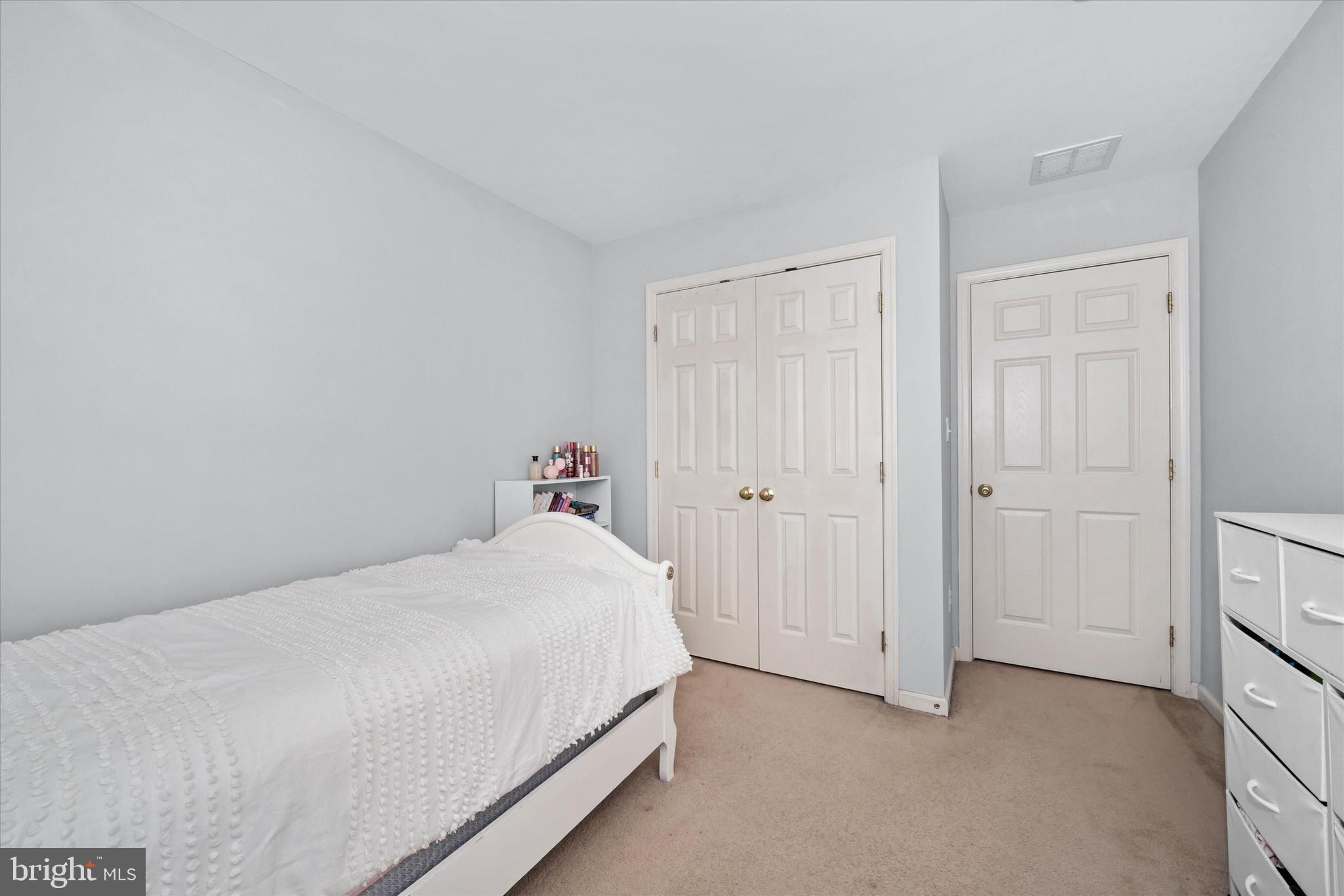 128 Springfield Circle Middletown, DE 19709 - Photo 16 of 22 a bedroom with a bed and a closet