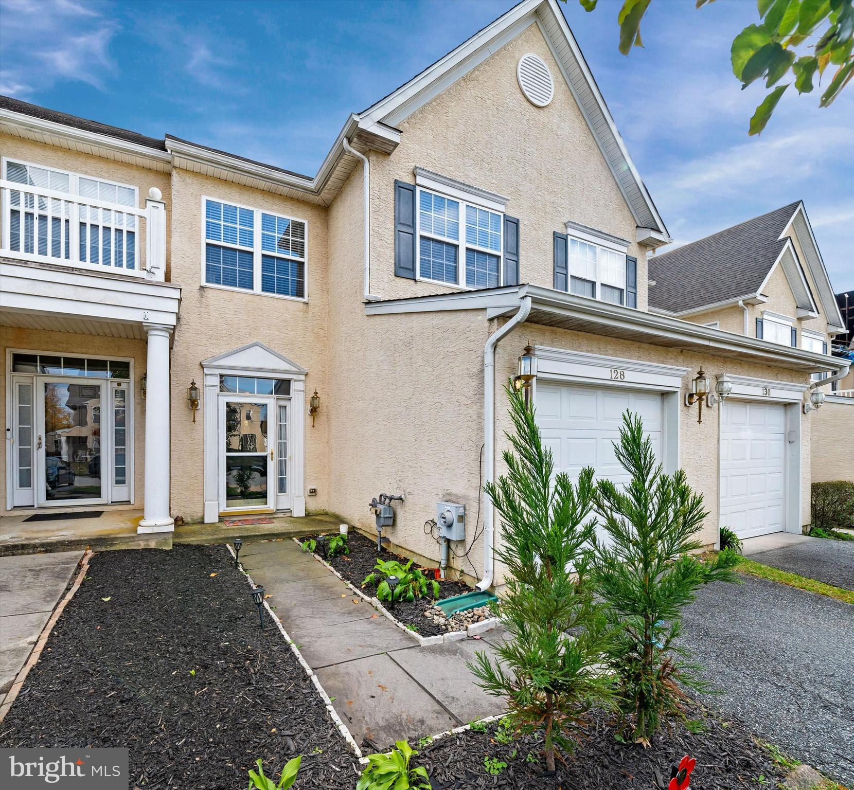128 Springfield Circle Middletown, DE 19709 - Photo 2 of 22 a front view of a house with garden