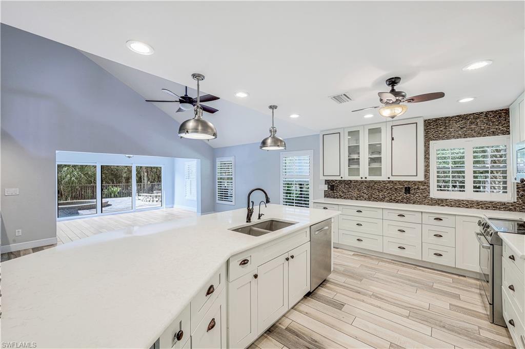 17680 Wildcat Drive Fort Myers, FL 33913 - Photo 13 of 50 a kitchen with granite countertop a sink stainless steel appliances and window