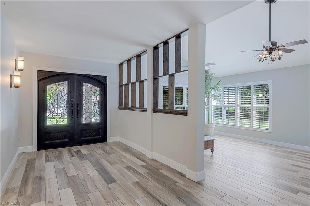 17680 Wildcat Drive Fort Myers, FL 33913 - Photo 14 of 50 a view of an empty room with a window and wooden floor
