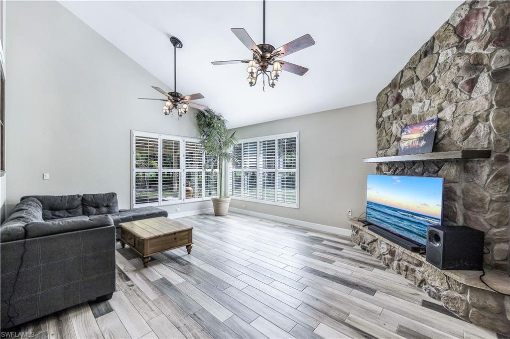 17680 Wildcat Drive Fort Myers, FL 33913 - Photo 16 of 50 a living room with furniture and a fireplace