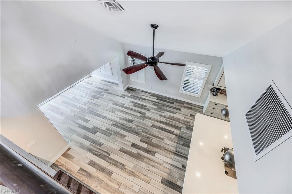 17680 Wildcat Drive Fort Myers, FL 33913 - Photo 23 of 50 a view of a livingroom with wooden floor and staircase