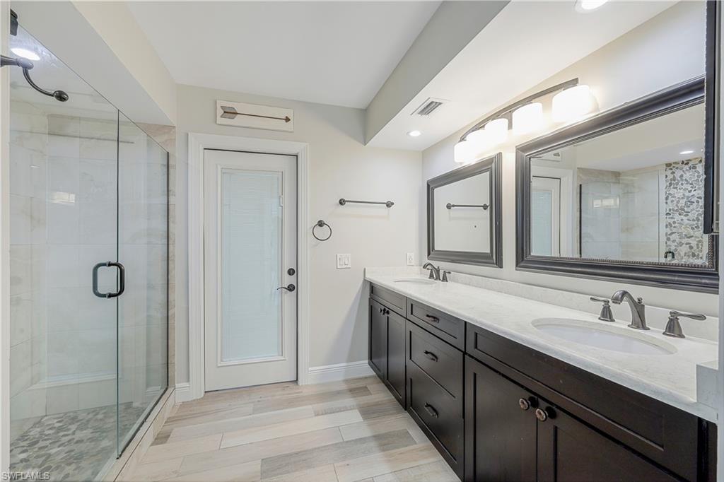 17680 Wildcat Drive Fort Myers, FL 33913 - Photo 29 of 50 a spacious bathroom with a double vanity sink mirror and double