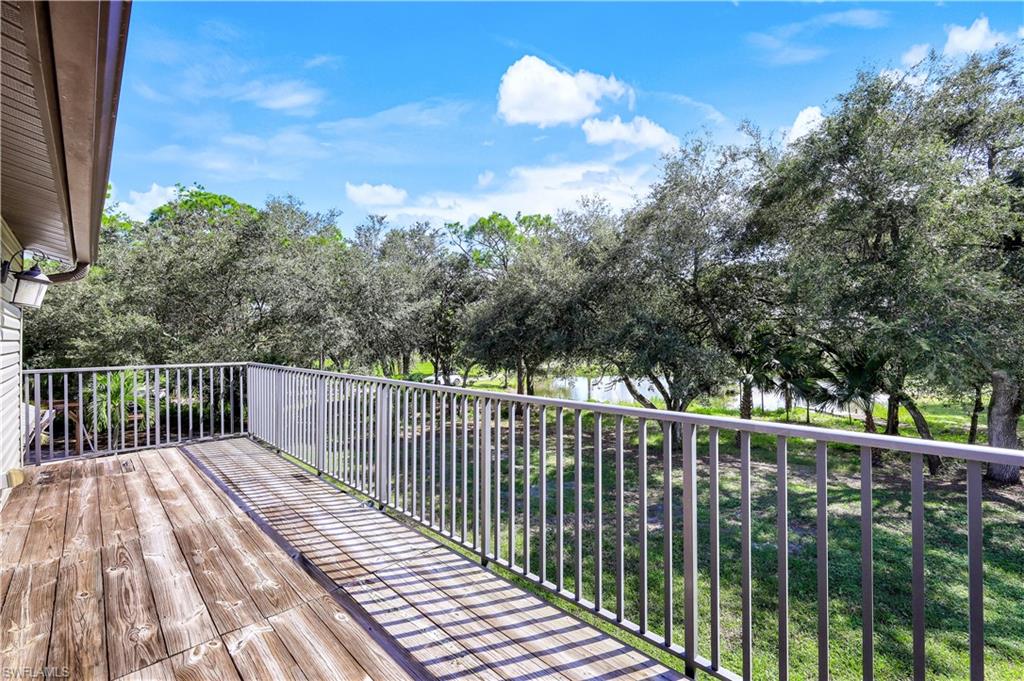 17680 Wildcat Drive Fort Myers, FL 33913 - Photo 31 of 50 a balcony with trees in front of it