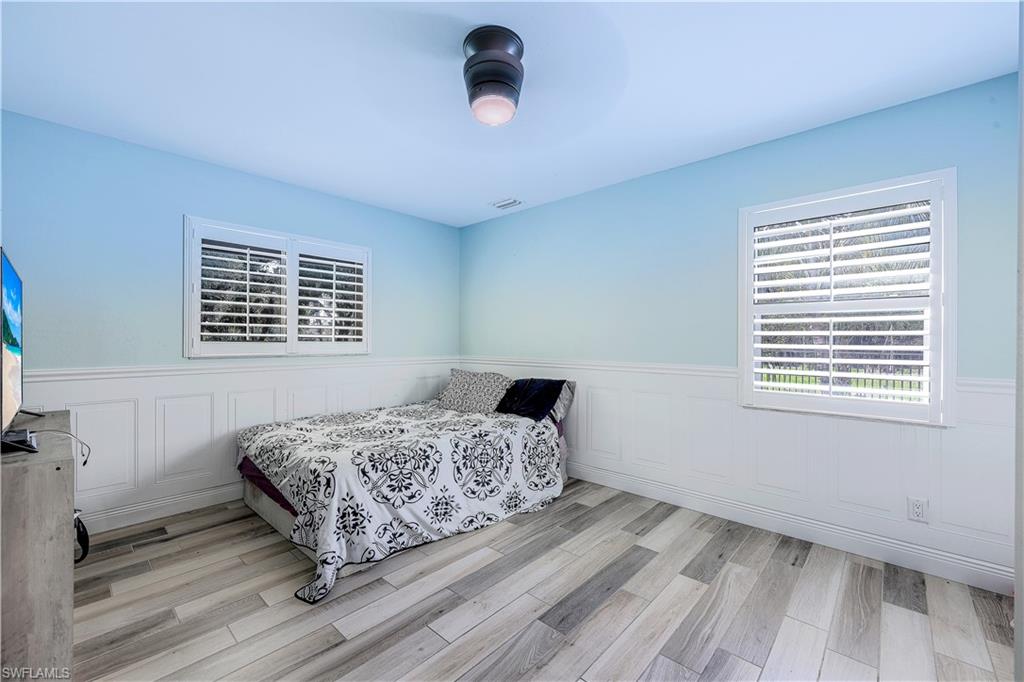 17680 Wildcat Drive Fort Myers, FL 33913 - Photo 32 of 50 a bedroom with a bed and a window