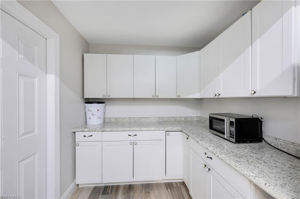 17680 Wildcat Drive Fort Myers, FL 33913 - Photo 33 of 50 a kitchen with cabinets appliances and a counter space