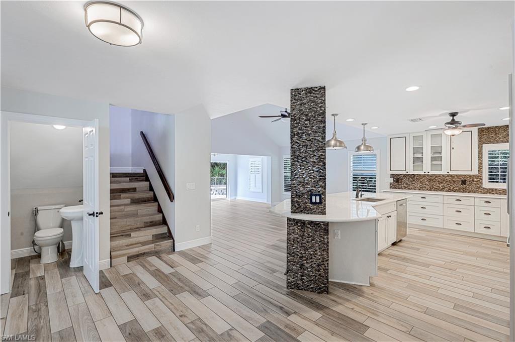 17680 Wildcat Drive Fort Myers, FL 33913 - Photo 4 of 50 a open kitchen with white cabinets and wooden floor