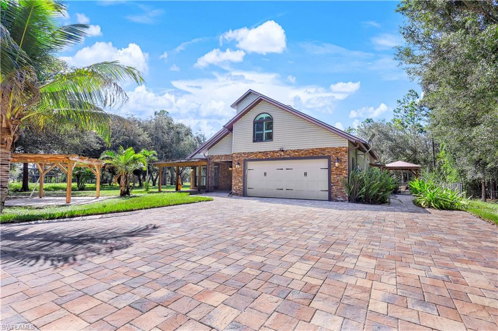17680 Wildcat Drive Fort Myers, FL 33913 - Photo 43 of 50 a front view of house with yard and green space