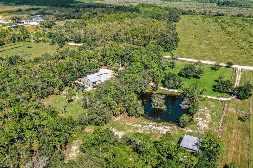 17680 Wildcat Drive Fort Myers, FL 33913 - Photo 48 of 50 a view of a lake with a building in the background