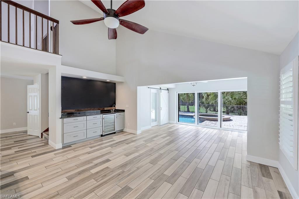 17680 Wildcat Drive Fort Myers, FL 33913 - Photo 6 of 50 a view of a livingroom with wooden floor and a ceiling fan