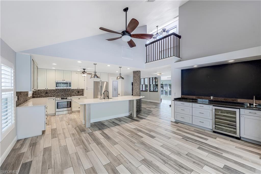 17680 Wildcat Drive Fort Myers, FL 33913 - Photo 9 of 50 a living room with furniture and a flat screen tv