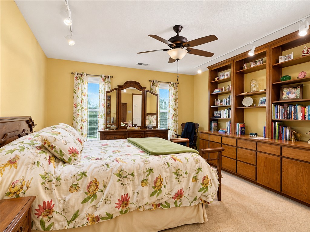 222 Terrace Drive Anderson, SC 29621 - Photo 22 of 37 Built-in shelving and soft carpeting enhance the comfort of this cheerful primary bedroom.