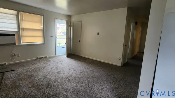 a view of an empty room with a window