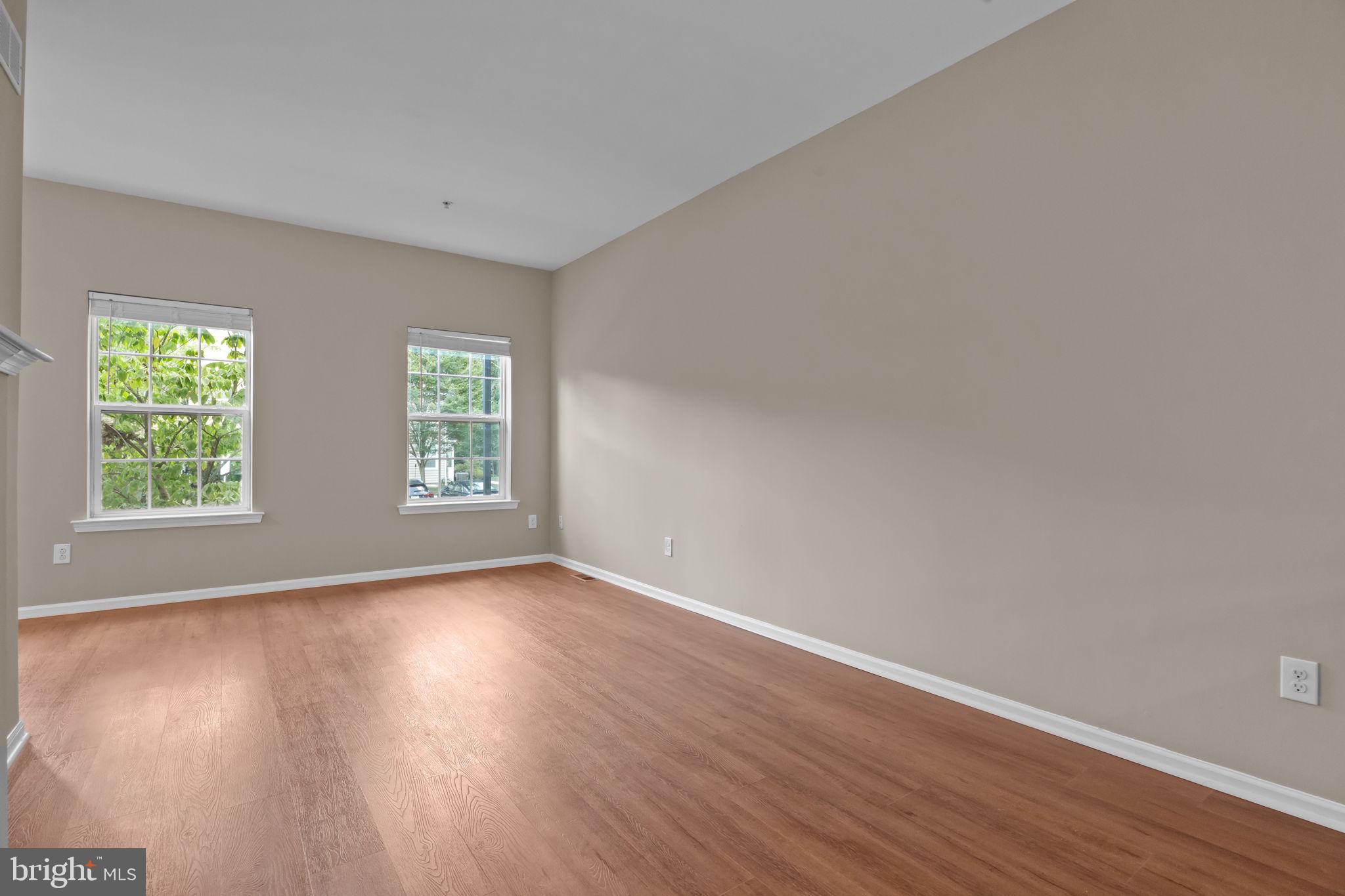 3880 Cephas Child Road, Unit 11 Doylestown, PA 18902 - Photo 14 of 34 an empty room with wooden floor and windows