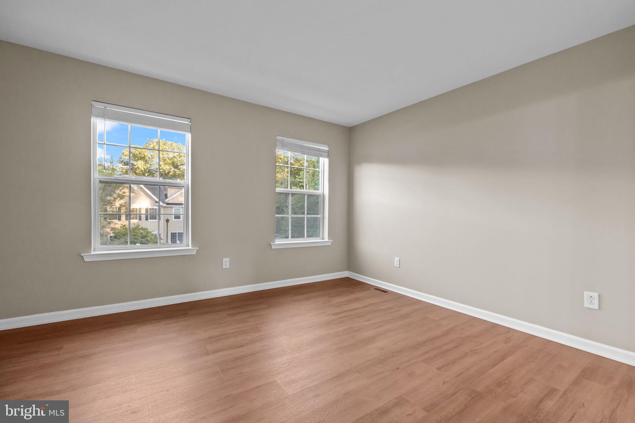 3880 Cephas Child Road, Unit 11 Doylestown, PA 18902 - Photo 15 of 34 a view of an empty room with wooden floor and a window