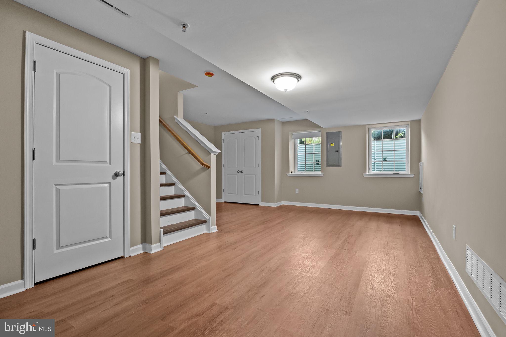 3880 Cephas Child Road, Unit 11 Doylestown, PA 18902 - Photo 20 of 34 a view of an empty room with wooden floor and stairs