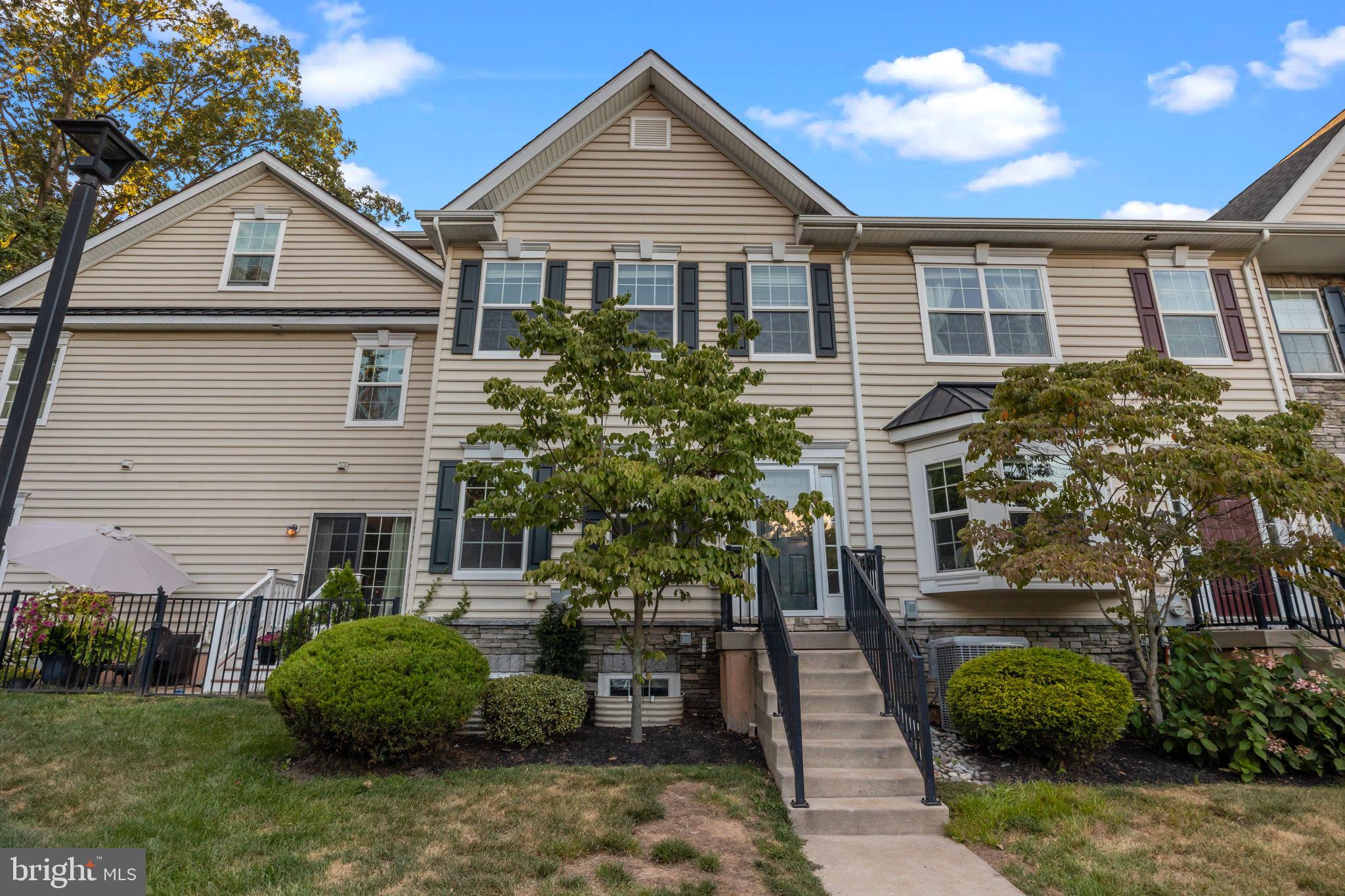 3880 Cephas Child Road, Unit 11 Doylestown, PA 18902 - Photo 2 of 34 a view of a house with a yard and plants