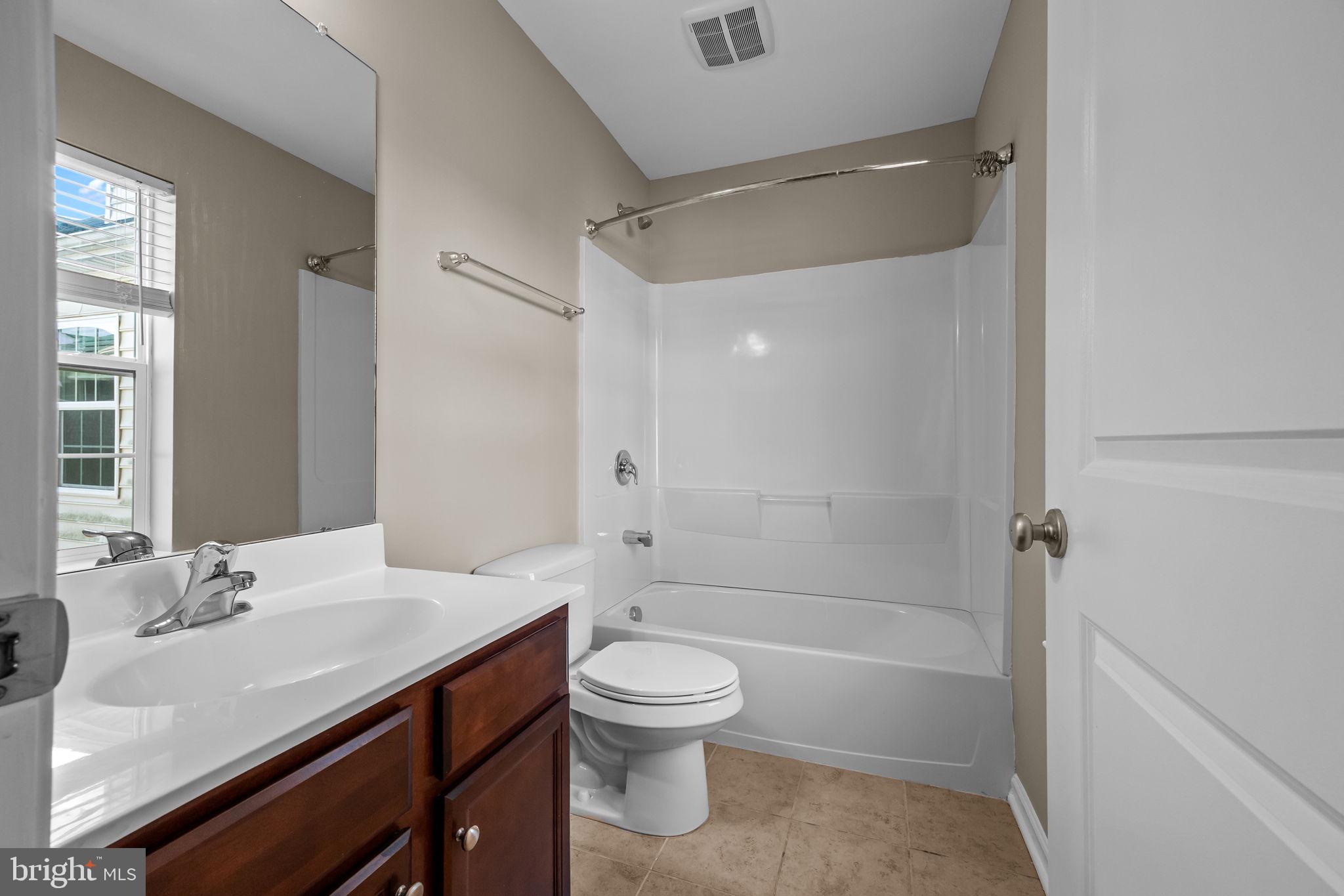 3880 Cephas Child Road, Unit 11 Doylestown, PA 18902 - Photo 24 of 34 a bathroom with a sink a toilet and shower