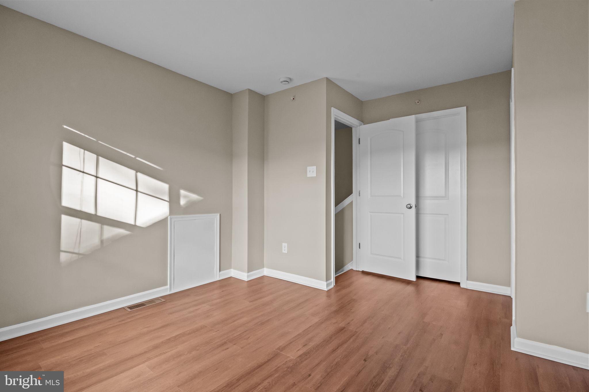 3880 Cephas Child Road, Unit 11 Doylestown, PA 18902 - Photo 25 of 34 a view of empty room with wooden floor and fan
