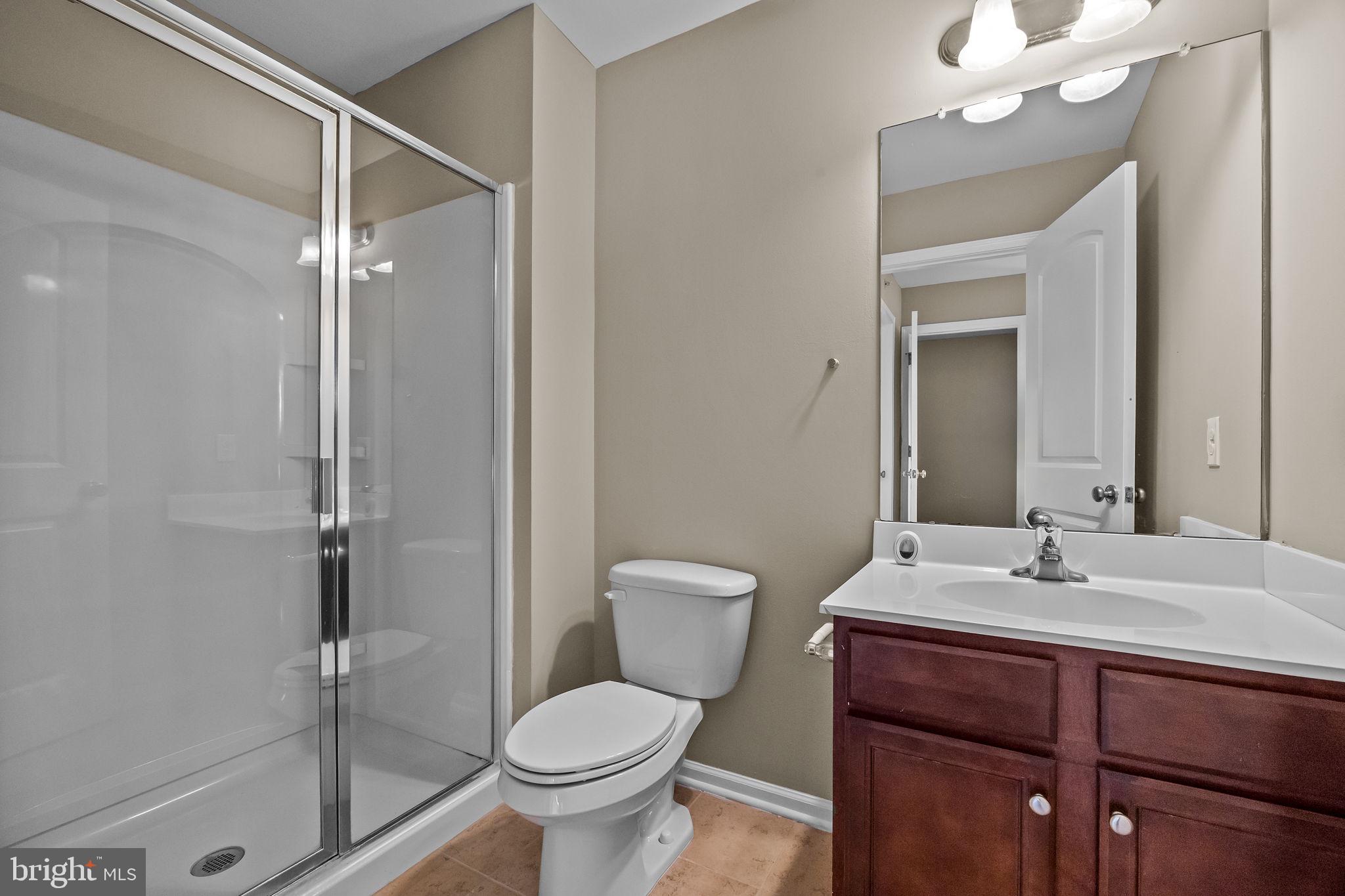 3880 Cephas Child Road, Unit 11 Doylestown, PA 18902 - Photo 27 of 34 a bathroom with a sink toilet and shower