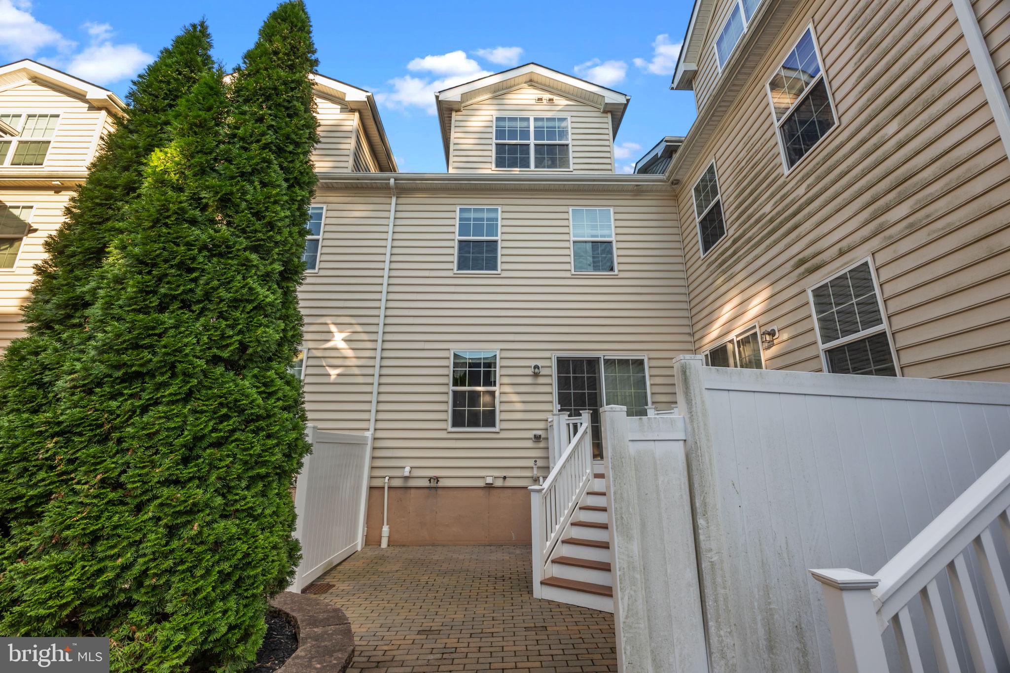 3880 Cephas Child Road, Unit 11 Doylestown, PA 18902 - Photo 29 of 34 a front view of a house with a yard