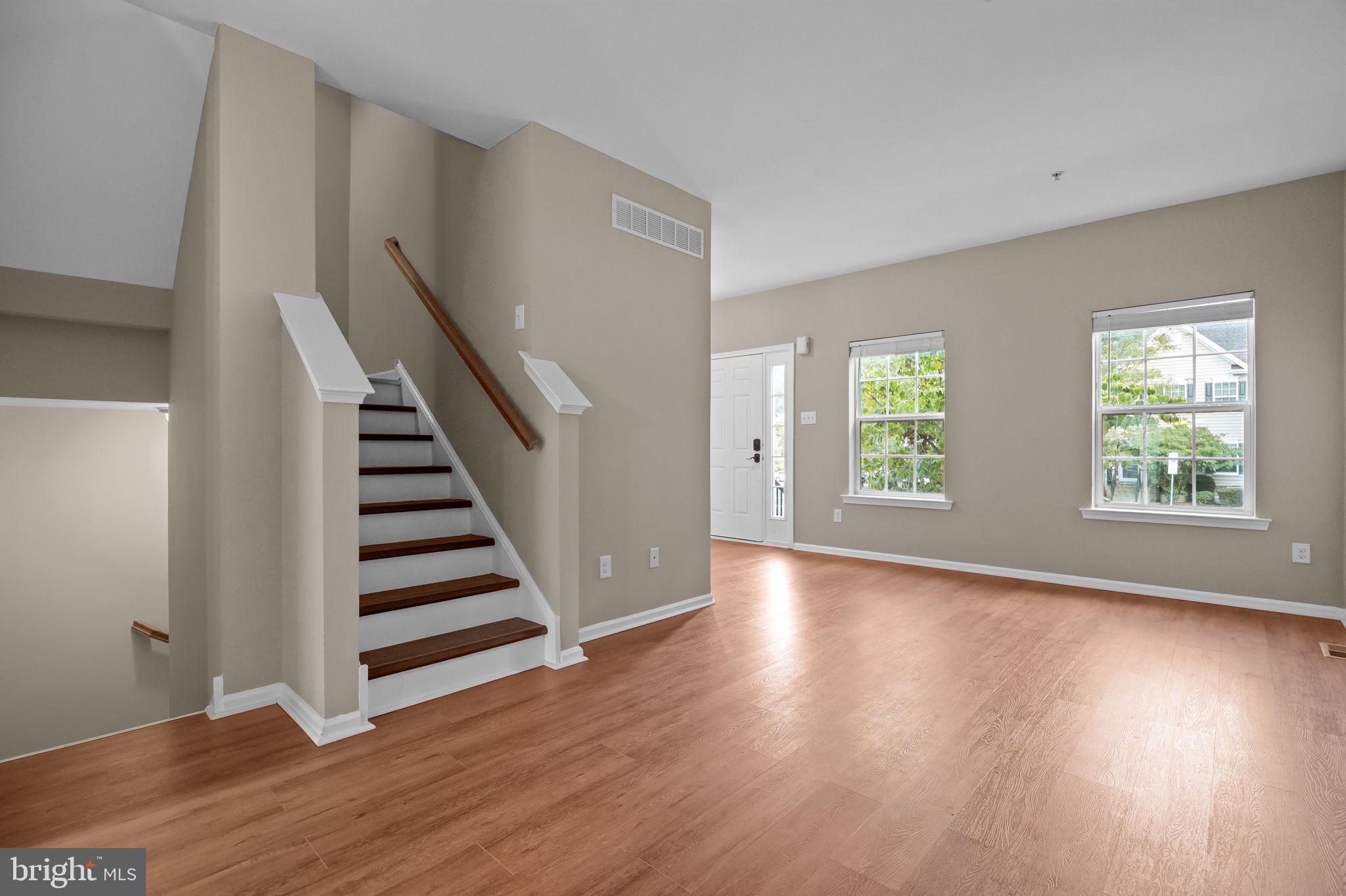 3880 Cephas Child Road, Unit 11 Doylestown, PA 18902 - Photo 3 of 34 a view of an empty room with wooden floor and window