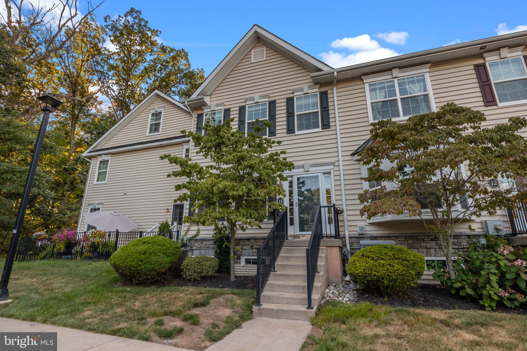 3880 Cephas Child Road, Unit 11 Doylestown, PA 18902 - Photo 32 of 34 a view of a house with a backyard