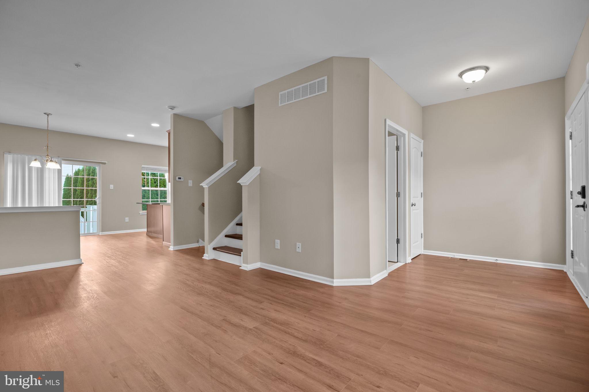 3880 Cephas Child Road, Unit 11 Doylestown, PA 18902 - Photo 4 of 34 a view of a livingroom with wooden floor and stairs