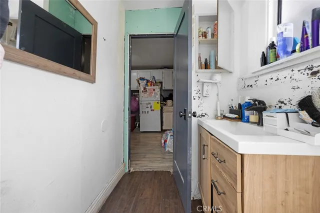 a view of a kitchen from the hallway