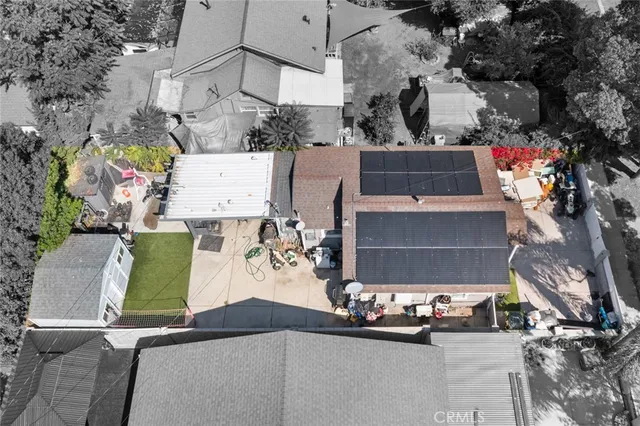 an aerial view of a house with a yard