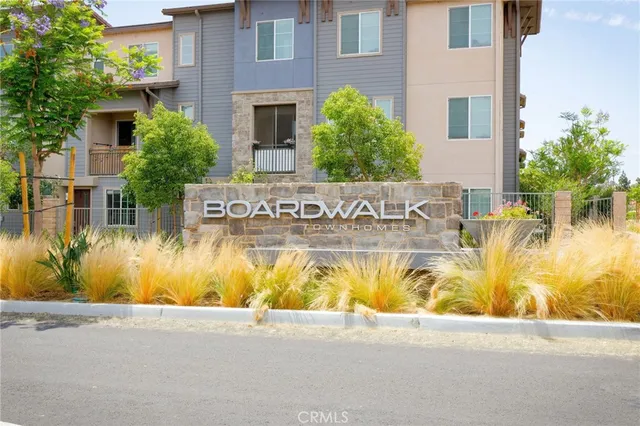 a view of swimming pool with palm trees