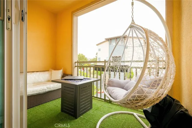 an outdoor space with swimming pool and furniture