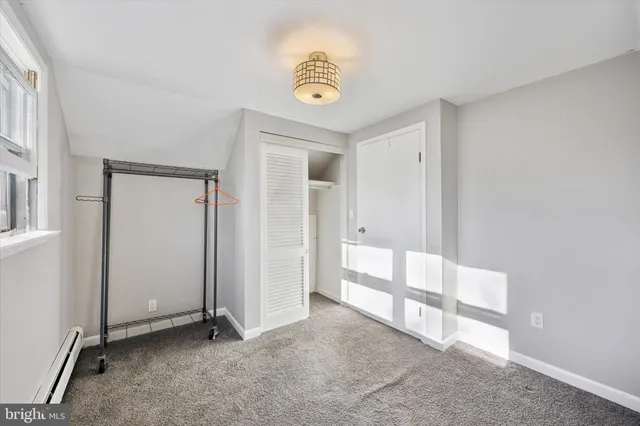 a view of a livingroom with wooden floor and flat screen tv