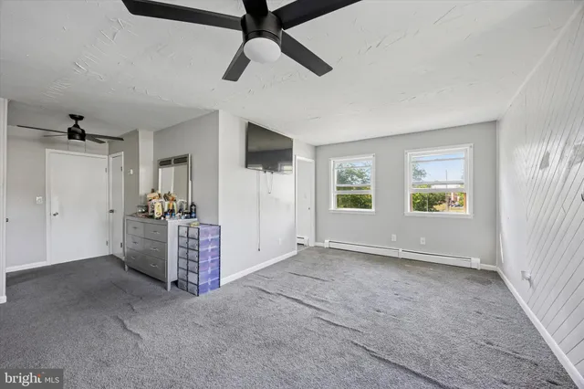 a view of room with window and furniture