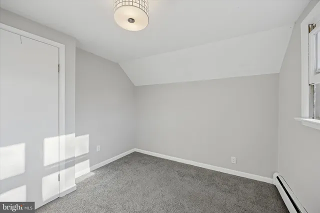 a bathroom with a sink a toilet and bathtub