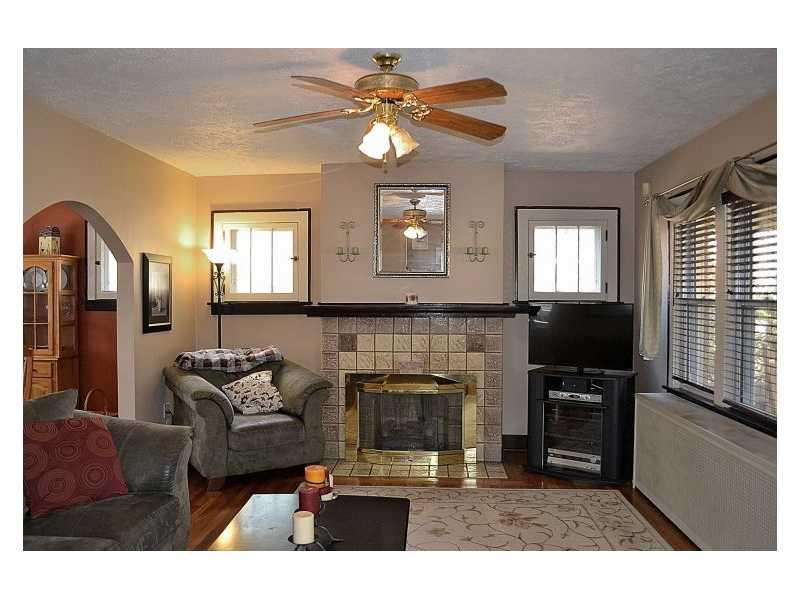 357 Goldsmith Road Pittsburgh, PA 15237 - Photo 2 of 25 Living Room. Living room has original hardwood flooring, windows and fireplace. Fireplace, with tile surround and hearth has been converted to gas.