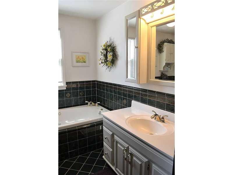 357 Goldsmith Road Pittsburgh, PA 15237 - Photo 11 of 25 Full Bath. The main bathroom is a huge space. Here there is a Whirlpool tub, as well as a stand alone shower. The tile in this lovely bathroom is green.