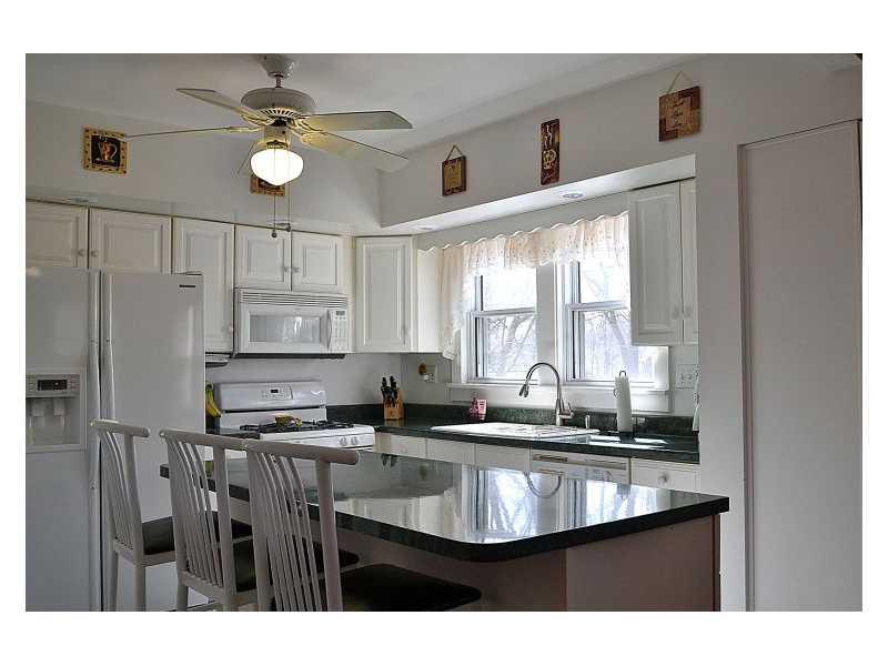 357 Goldsmith Road Pittsburgh, PA 15237 - Photo 7 of 25 Kitchen. The kitchen has a full array of appliances: refrigerator with ice/water, double bowled porcelain sink, gas stove with microwave, dishwasher and garbage disposal. The stools will remain with the sale.