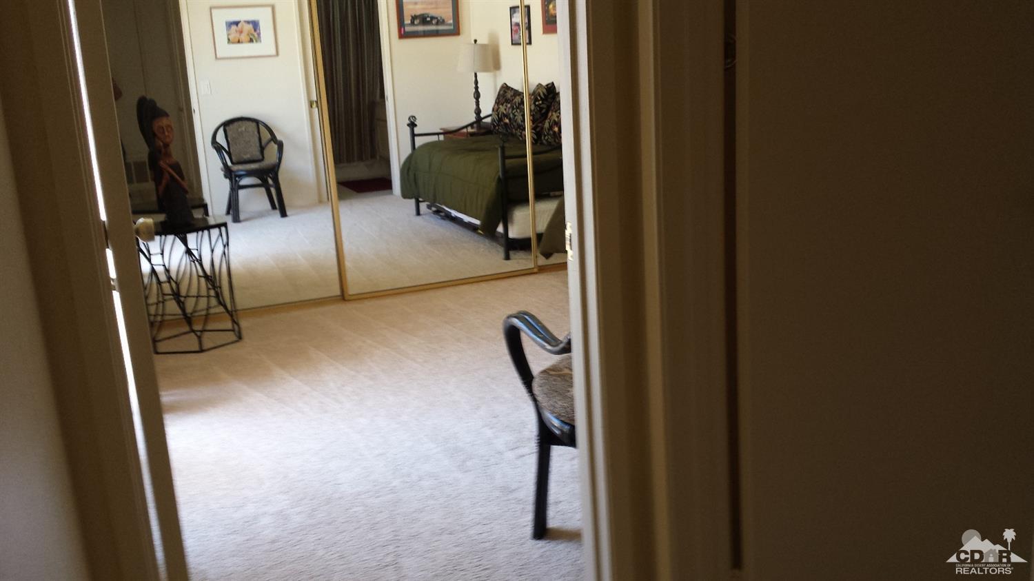 19 La Ronda Drive Rancho Mirage, CA 92270 - Photo 2 of 11 a view of a gallery with mirror