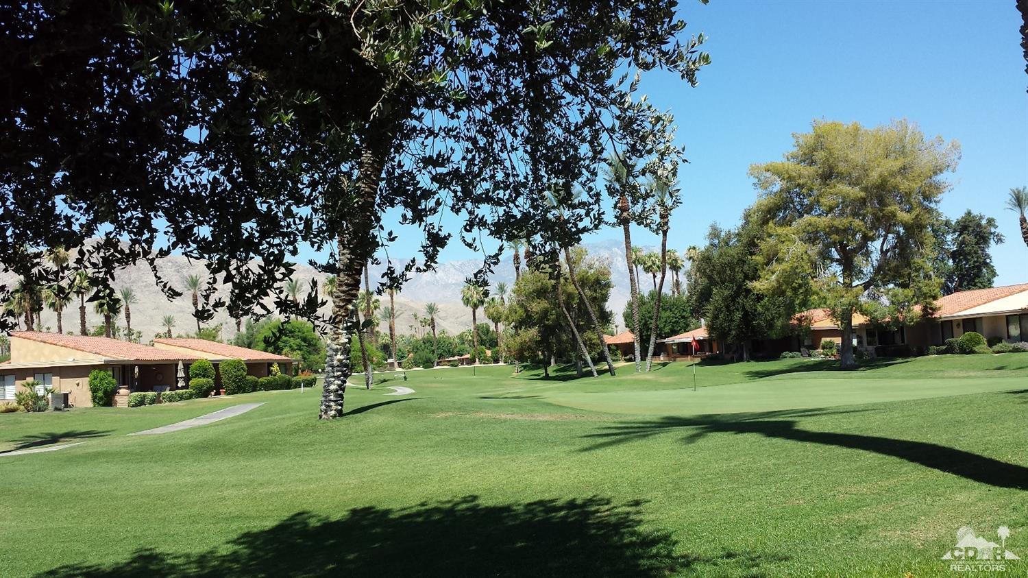 19 La Ronda Drive Rancho Mirage, CA 92270 - Photo 4 of 11 a view of a park with large trees