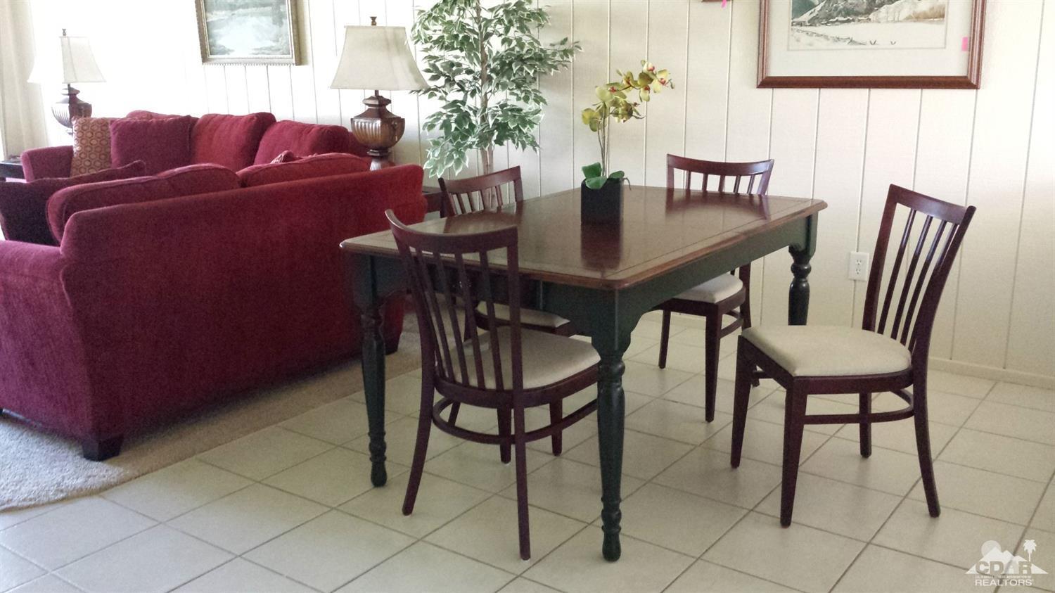 19 La Ronda Drive Rancho Mirage, CA 92270 - Photo 8 of 11 a view of a dining room with furniture