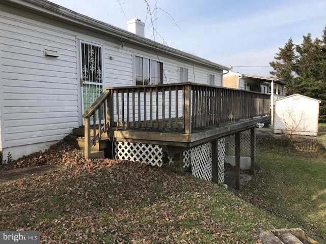 1419 Hallwood Road Baltimore, MD 21228 - Photo 12 of 14 a view of backyard with a deck and furniture