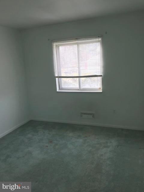 1419 Hallwood Road Baltimore, MD 21228 - Photo 7 of 14 an empty room with a window