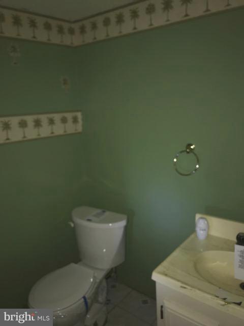 1419 Hallwood Road Baltimore, MD 21228 - Photo 9 of 14 a bathroom with a toilet and a sink
