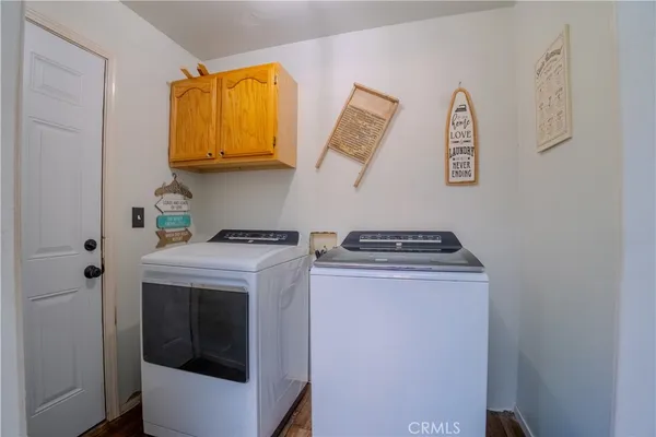 a view of storage and utility room with washer and dryer