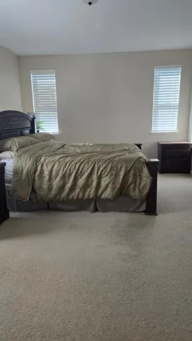 a bedroom with washing machine