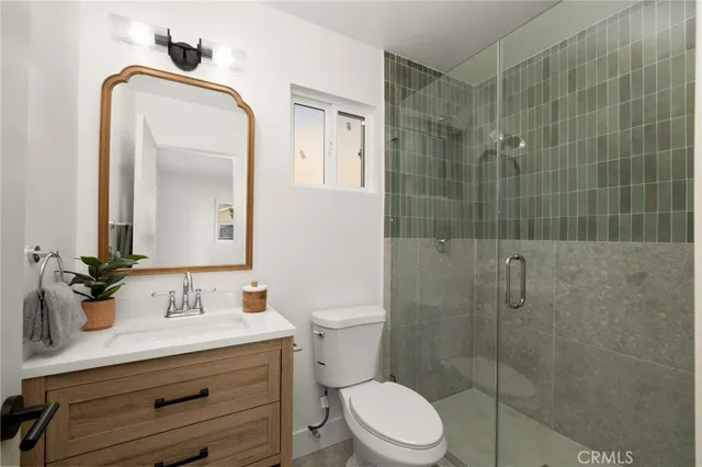 a bedroom with furniture and wooden floor