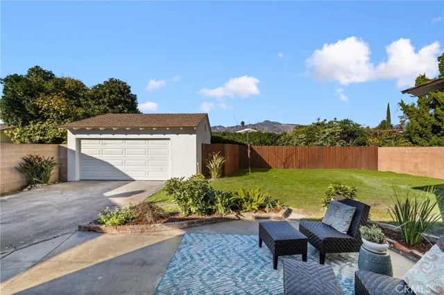 an aerial view of residential house and an outdoor space