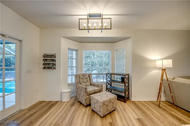 a bedroom with furniture and a window